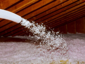 Spraying Blown in Fiberglass Insulation for Roof attic
