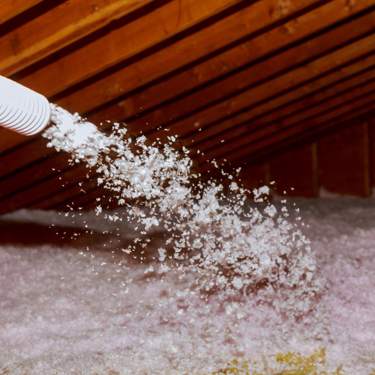 Spraying Blown Fiberglass Insulation for Roof attic